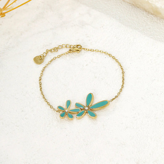Bracelet chaîne dorée fine double fleur bleue
